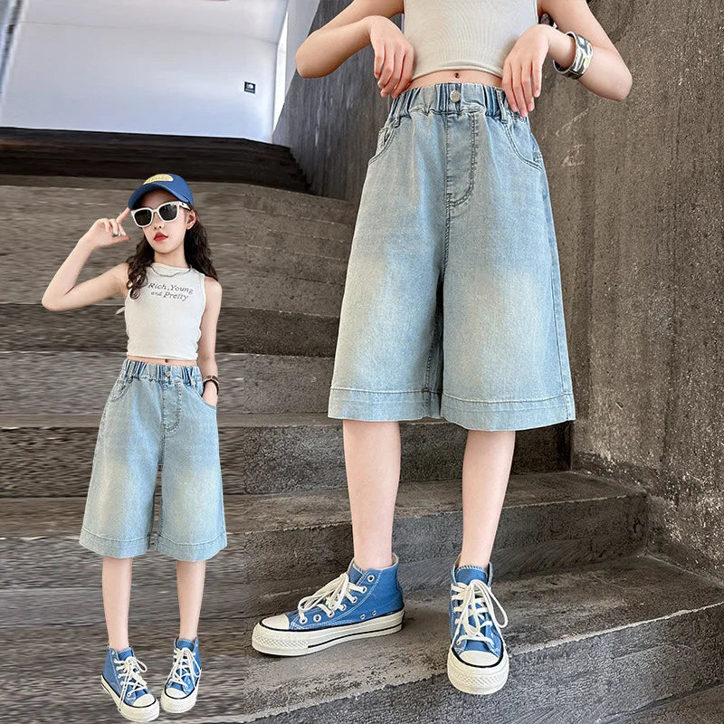 child wearing knee length denim shorts close up
