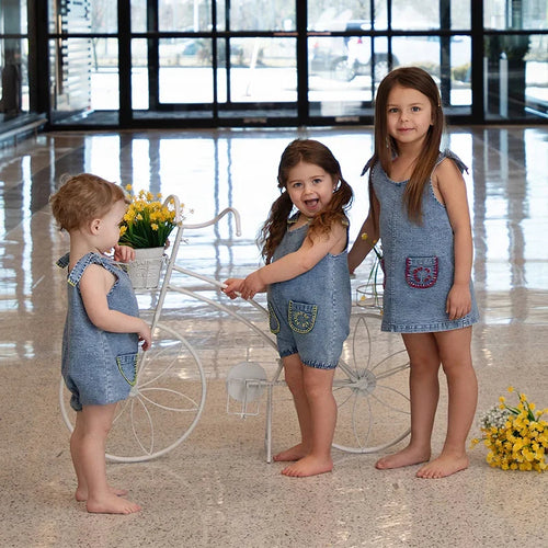children wearing coordinated denim clothing set
